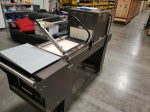 Used - Like New - PP-1519ECMC Shrinkwrap Machine w/ Magnetic Hold Down and Discharge Conveyor